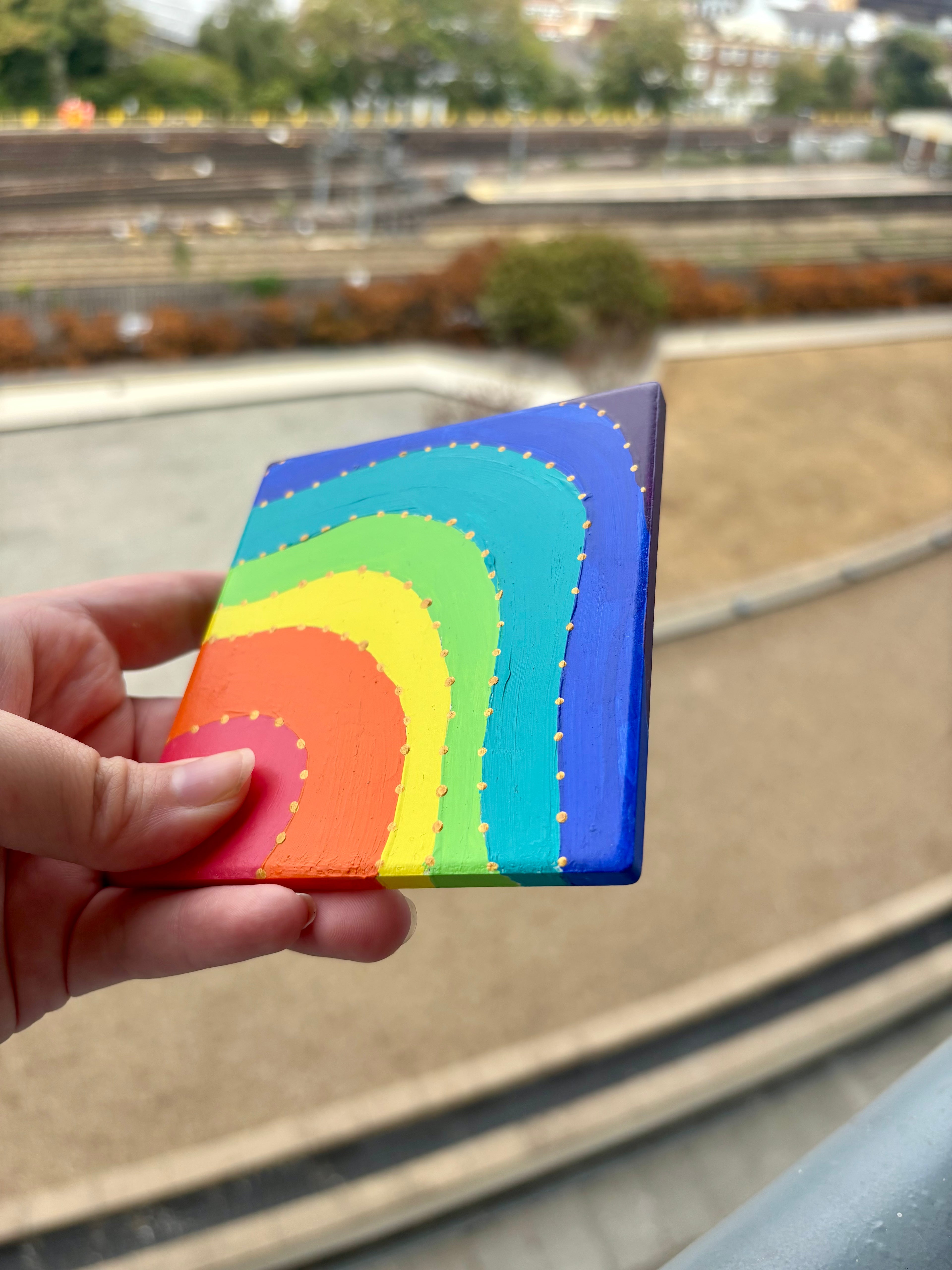 Set of 4 colourful ceramic coasters.