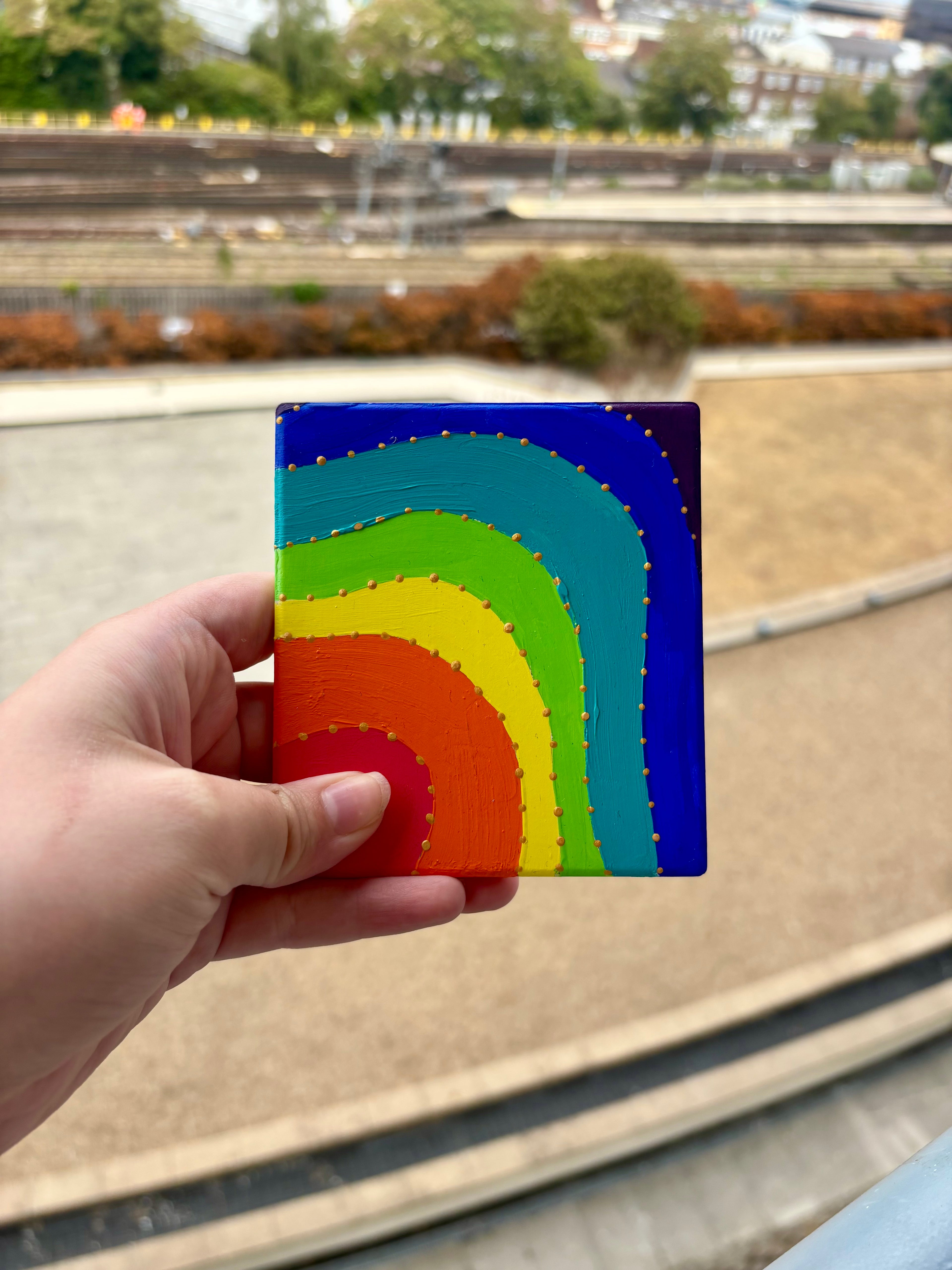 Set of 4 colourful ceramic coasters.